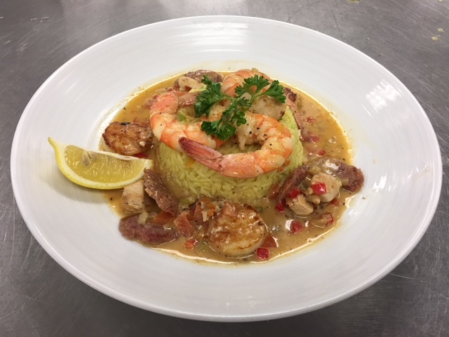 Paella around Saffron Rice topped with Shrimp