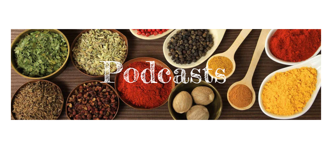 Assorted spices in dishes with the word PODCASTS in white chalk writing